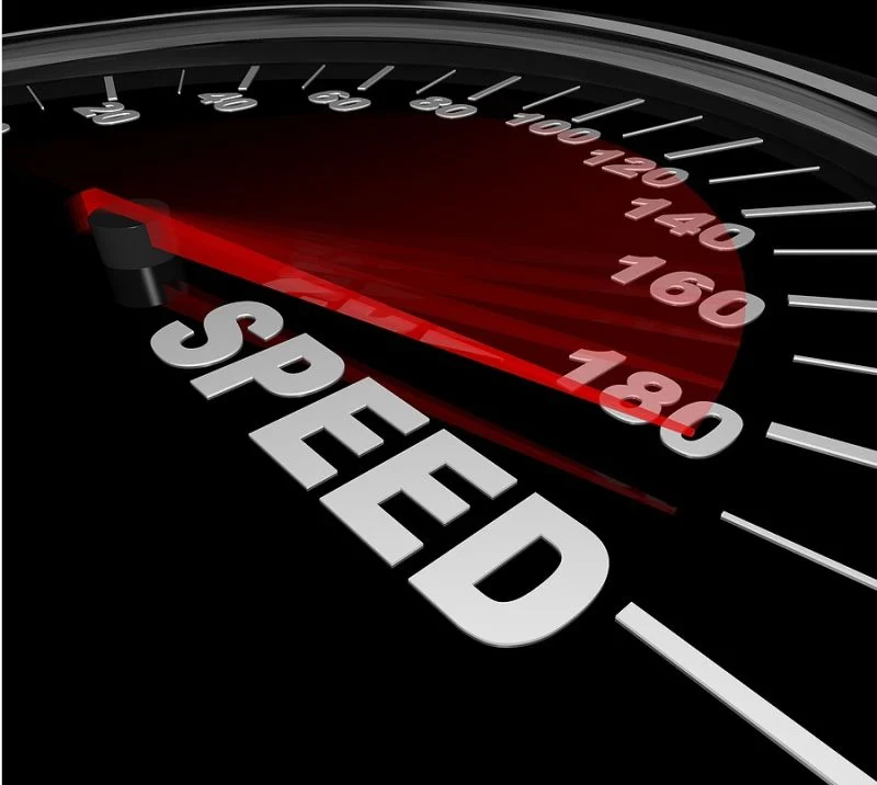Car speedometer needle near 180 with the word SPEED across the dial